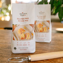 Load image into Gallery viewer, Two packages of gluten-free scone mix on a wooden table with a plant in the background.
