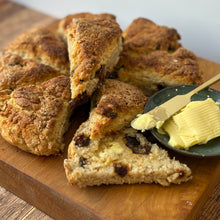 Load image into Gallery viewer, Scones on a wooden board with a dish of butter