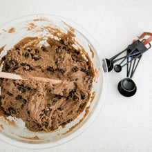 Load image into Gallery viewer, Gluten free  Hot cross bun dough in glass bowl  with black measuring  on the side. 